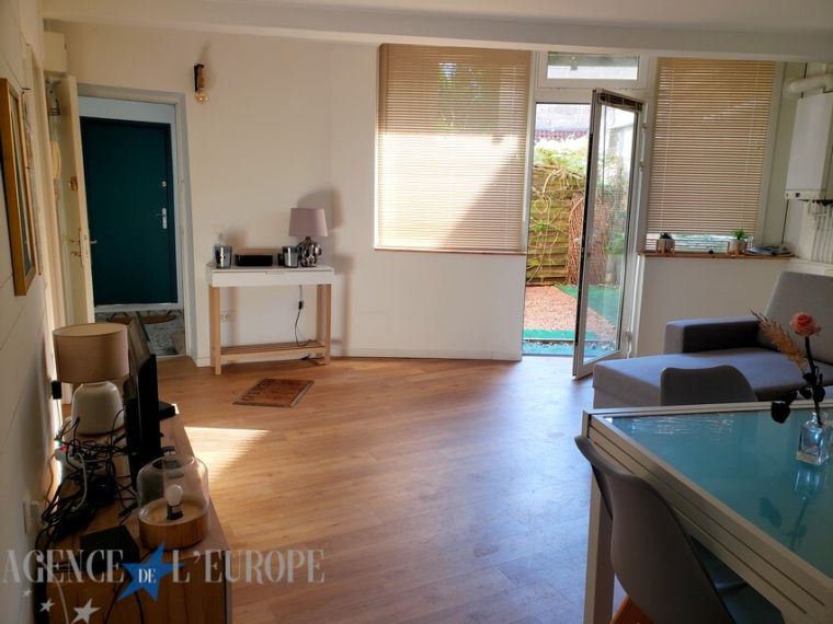 Charmant 3 pièces en rez-de-jardin – immeuble de caractère